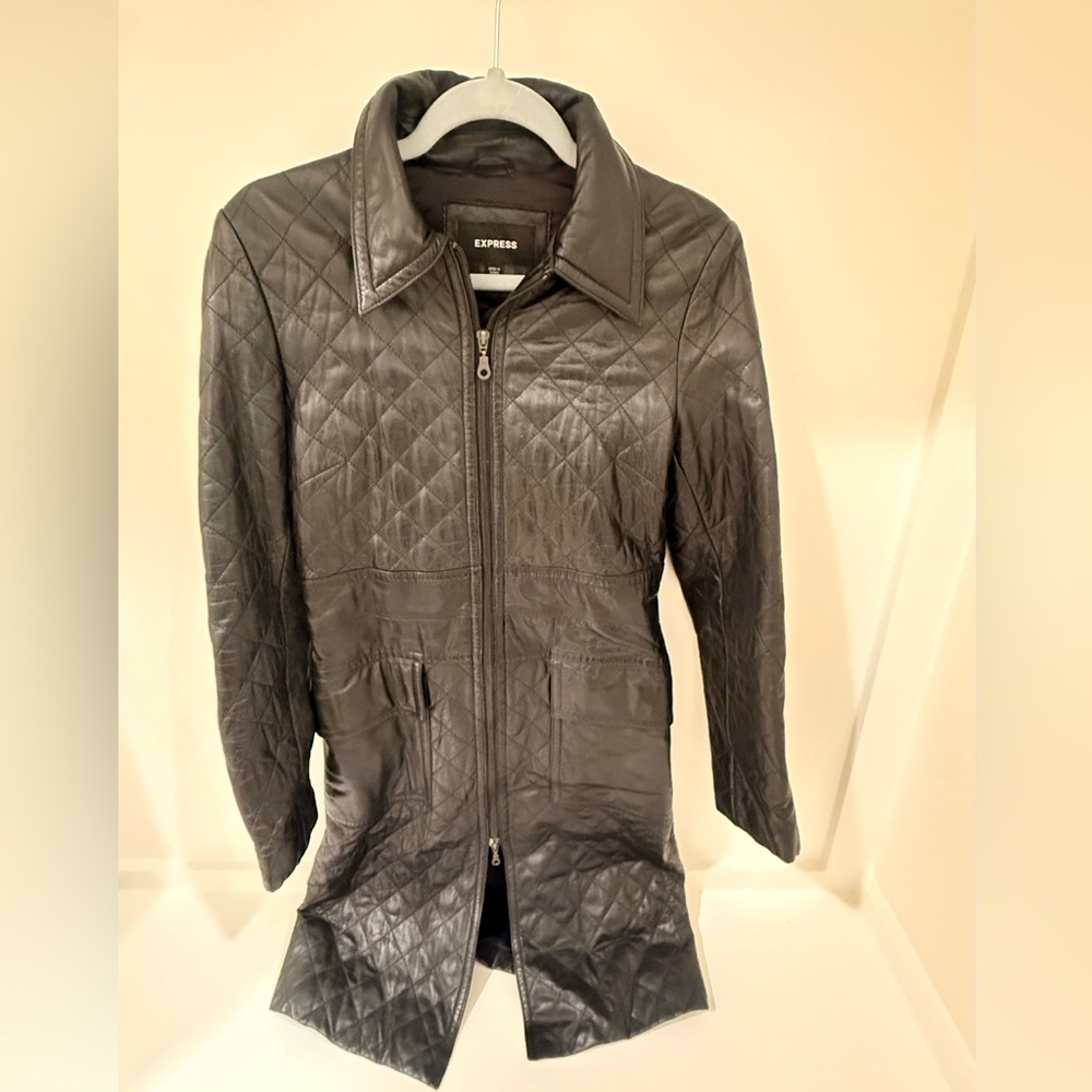 100% genuine leather lined tailored style trench coat.